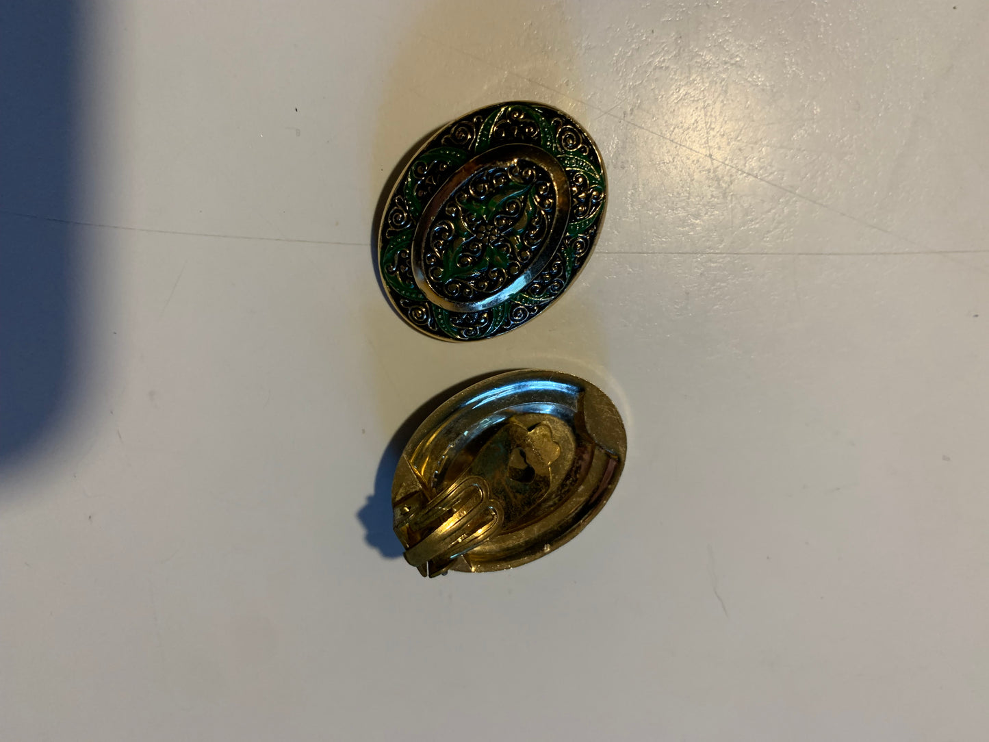 Green Metal Medallion Cip Earrings circa 1960s