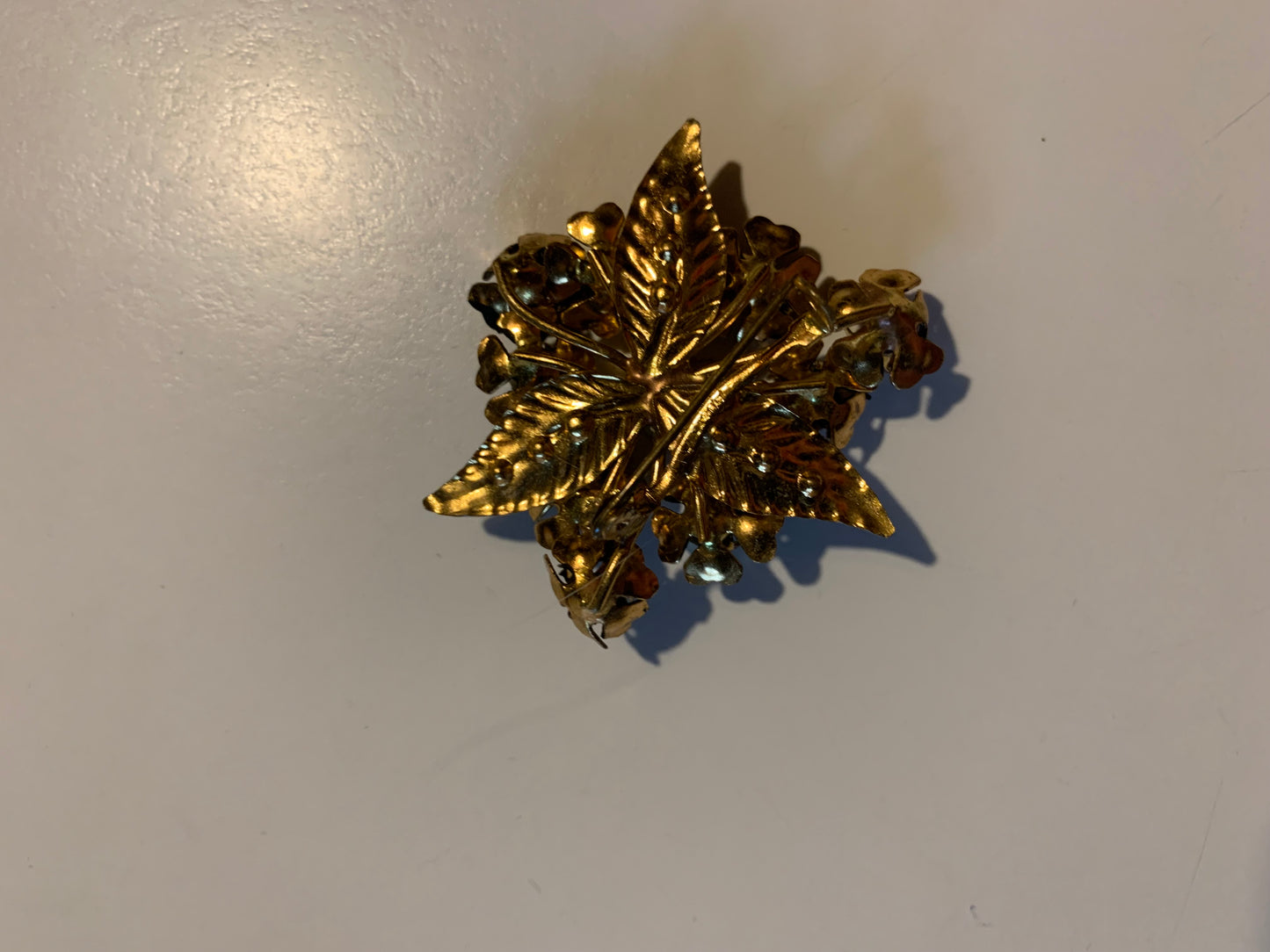Enameled Metal Black Flower and Rhinestone Brooch circa 1960s