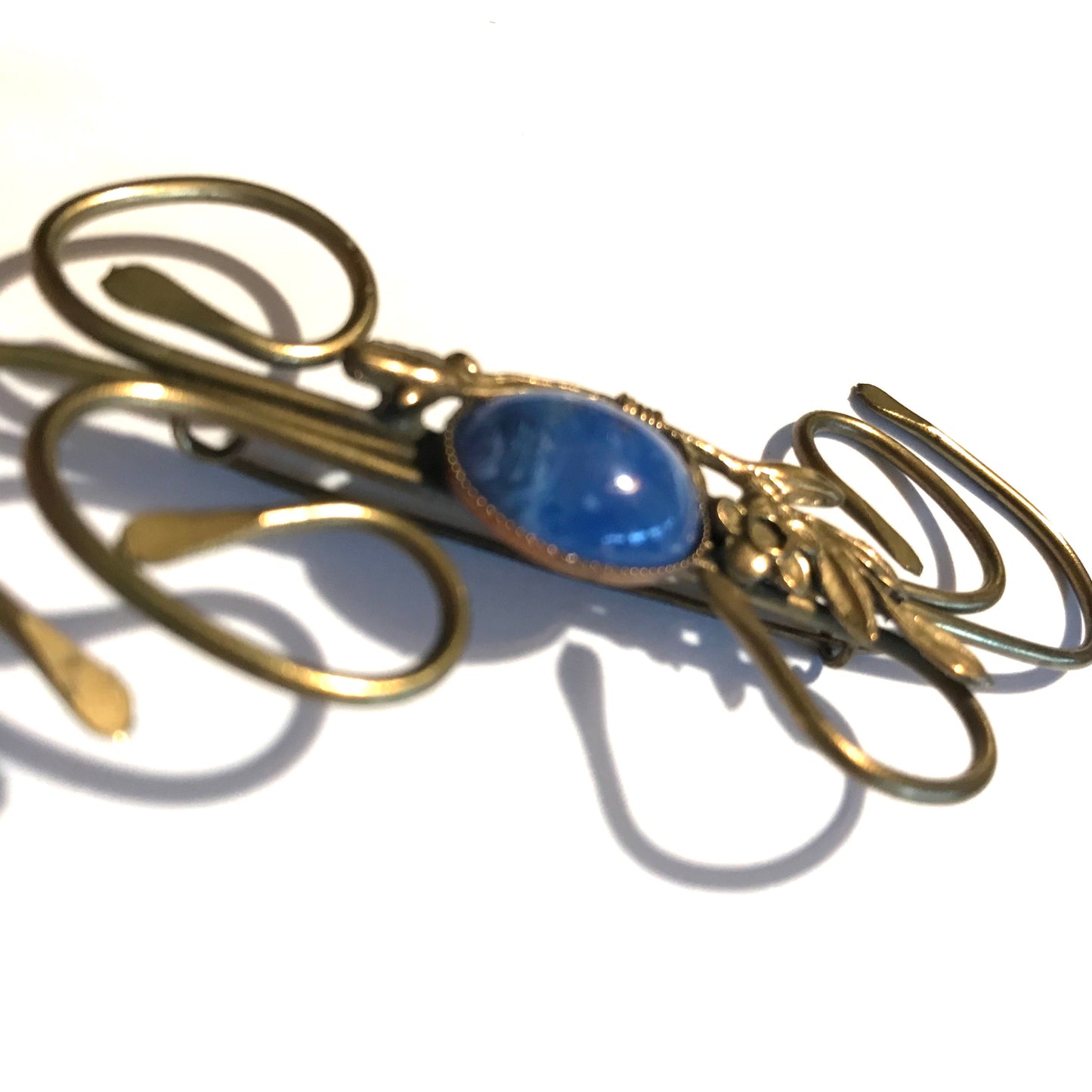 Medusa Inspired Gold Flower and Vine Brooch with Blue Art Glass Center circa 1910s