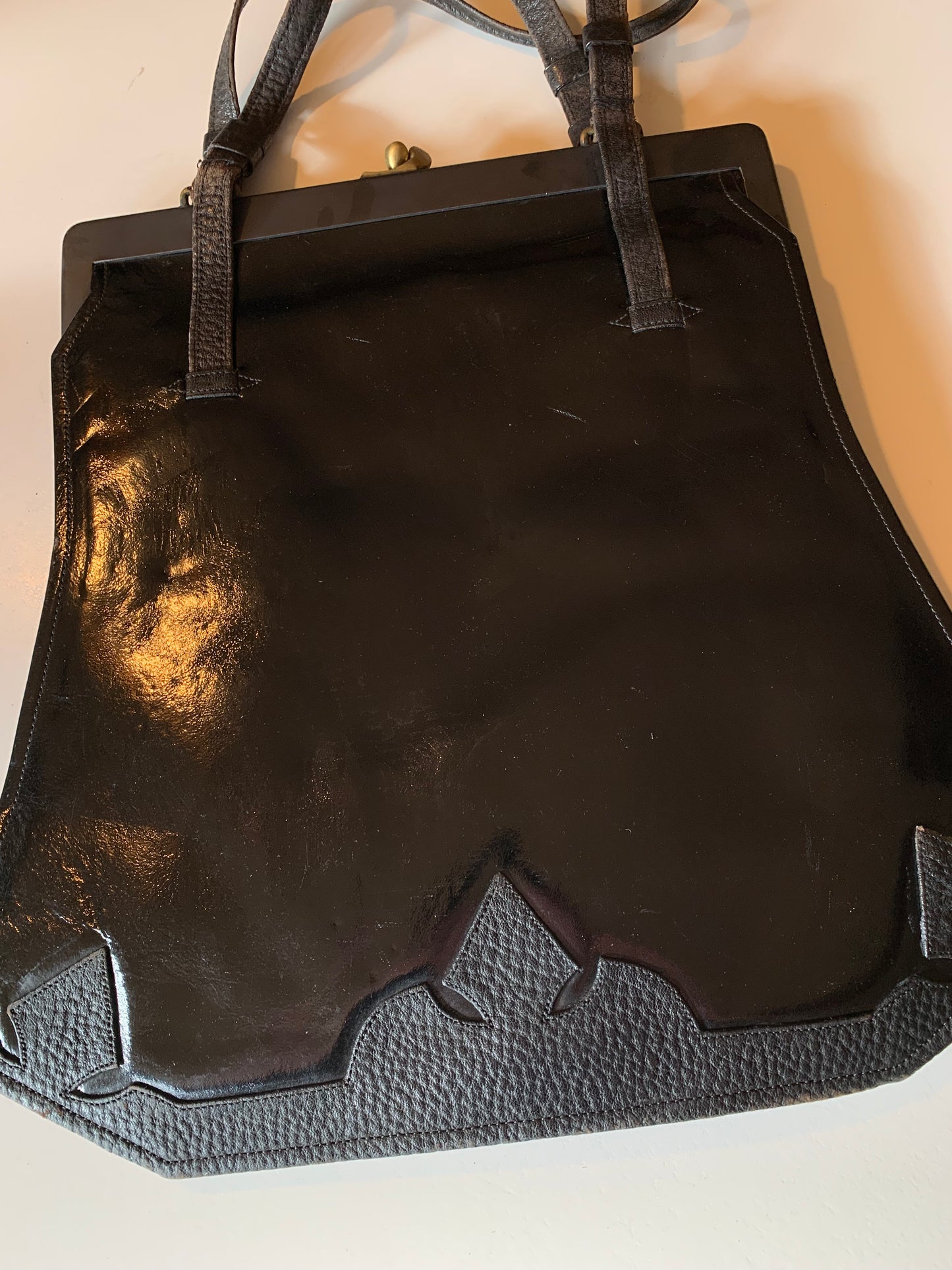 Large Black Patent Leather Handbag with Textured Leather Floral Design circa 1910s