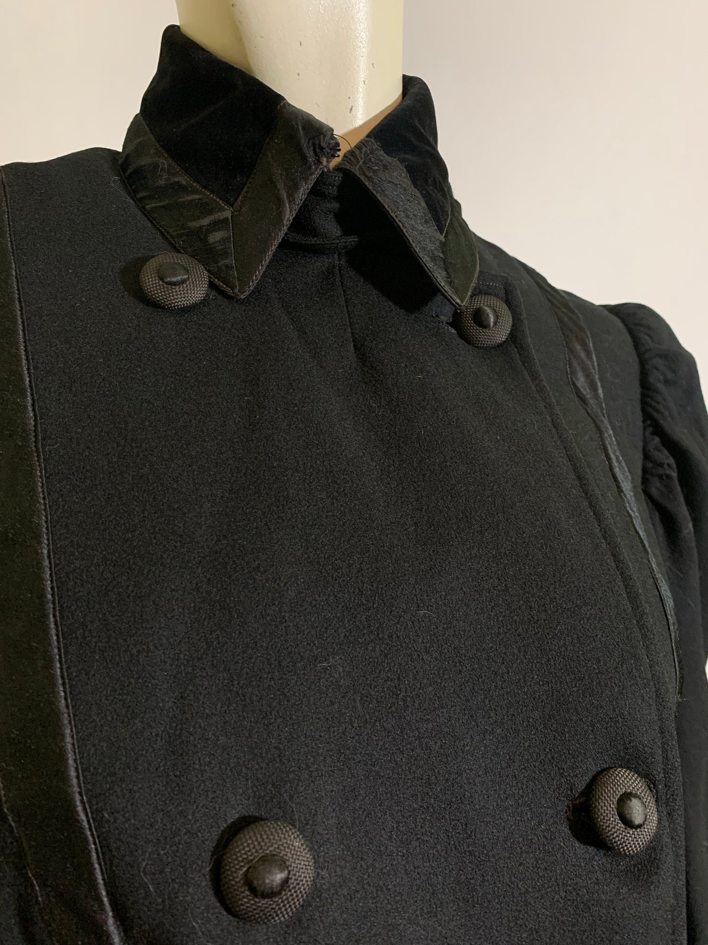 Beautiful Black Wool Double Breasted Coat with Silk Ribbon Design and Button Trimmed Back circa Early 1900s