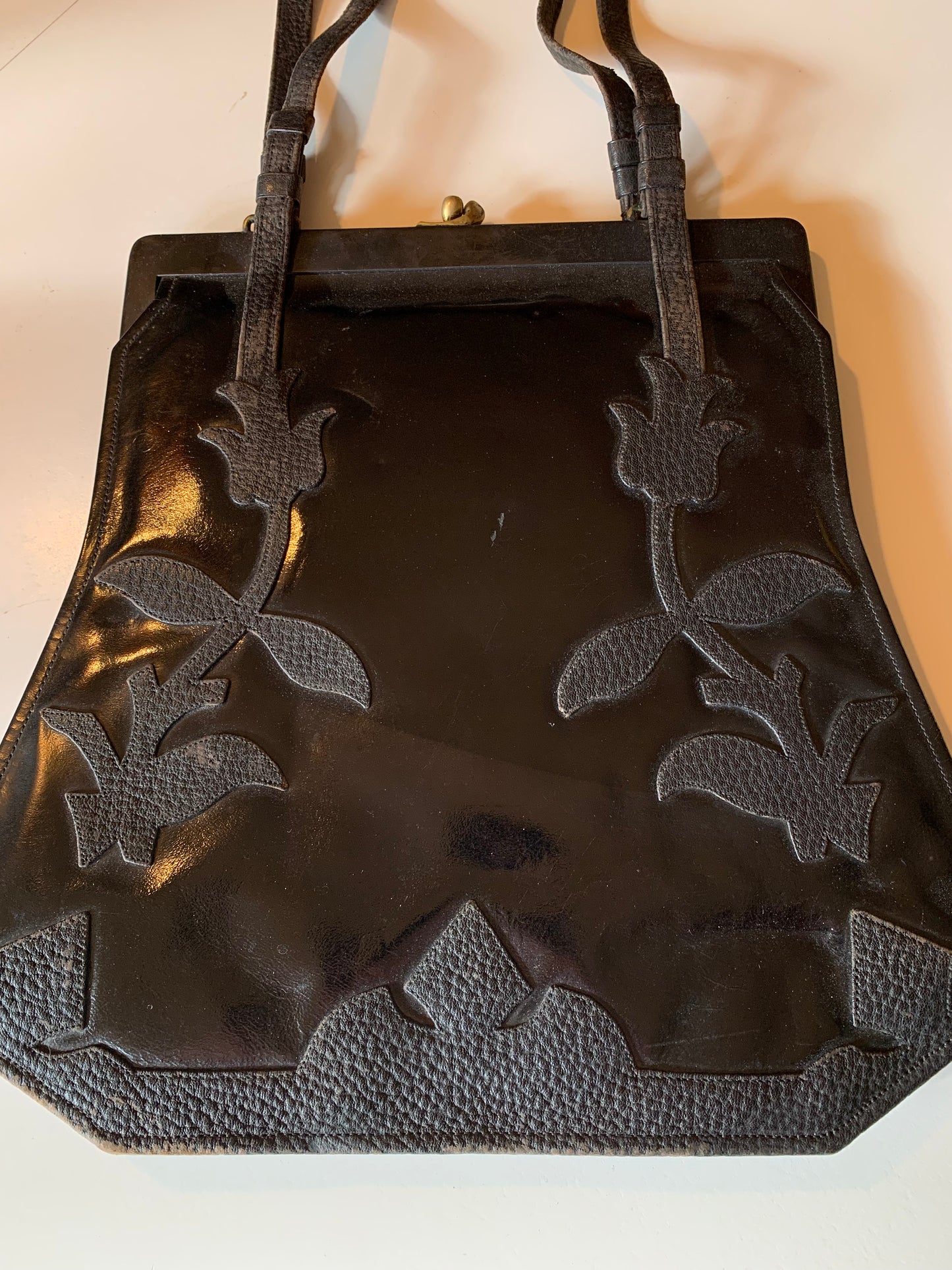 Large Black Patent Leather Handbag with Textured Leather Floral Design circa 1910s