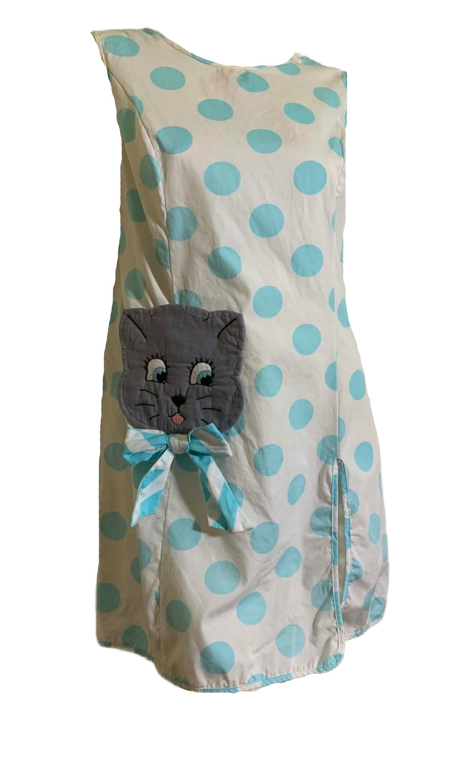 Polka dot vintage dress with a cat face design on a white background
