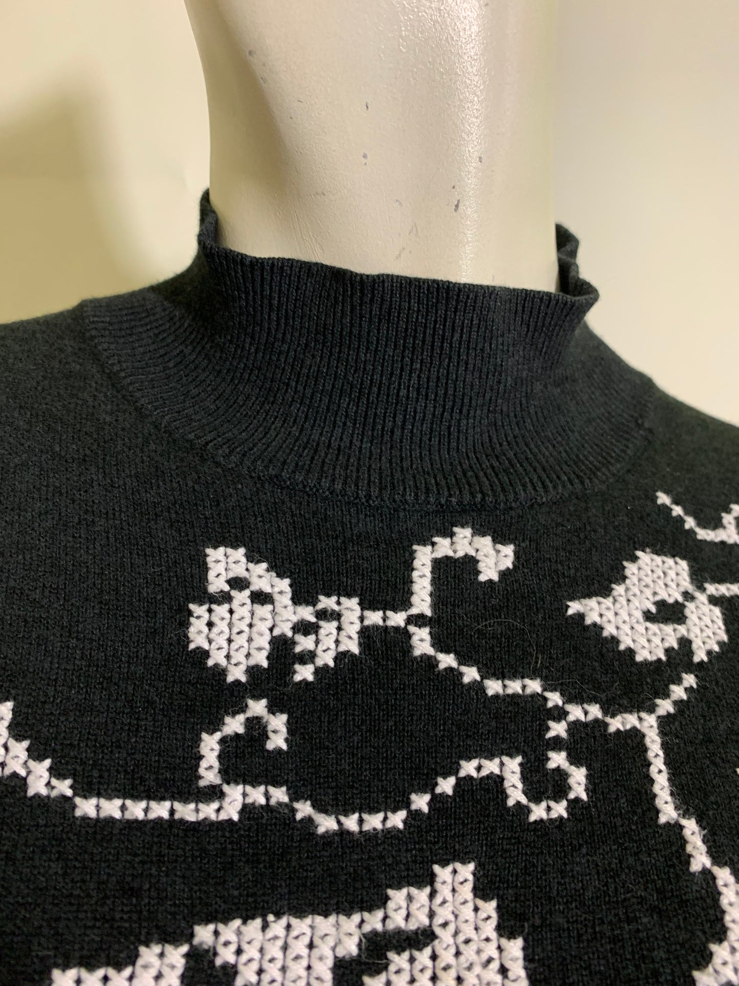 Black Puffed Shoulder Cross Stitched Long Sleeved Sweater circa 1970s